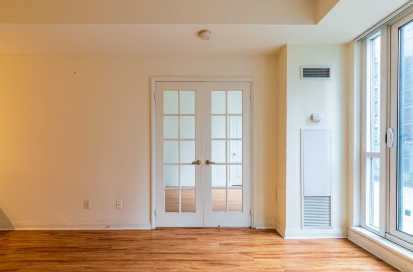 Apartment for Rent at Elev’n Residences. Toronto, Ontario. Living Room Master Door